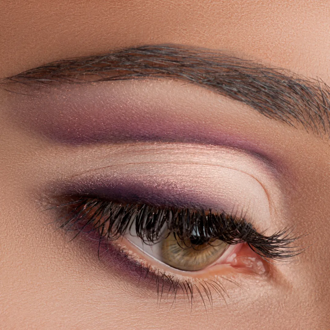 Close-up of vibrant eye makeup with purple and nude tones, perfect for beauty inspiration.